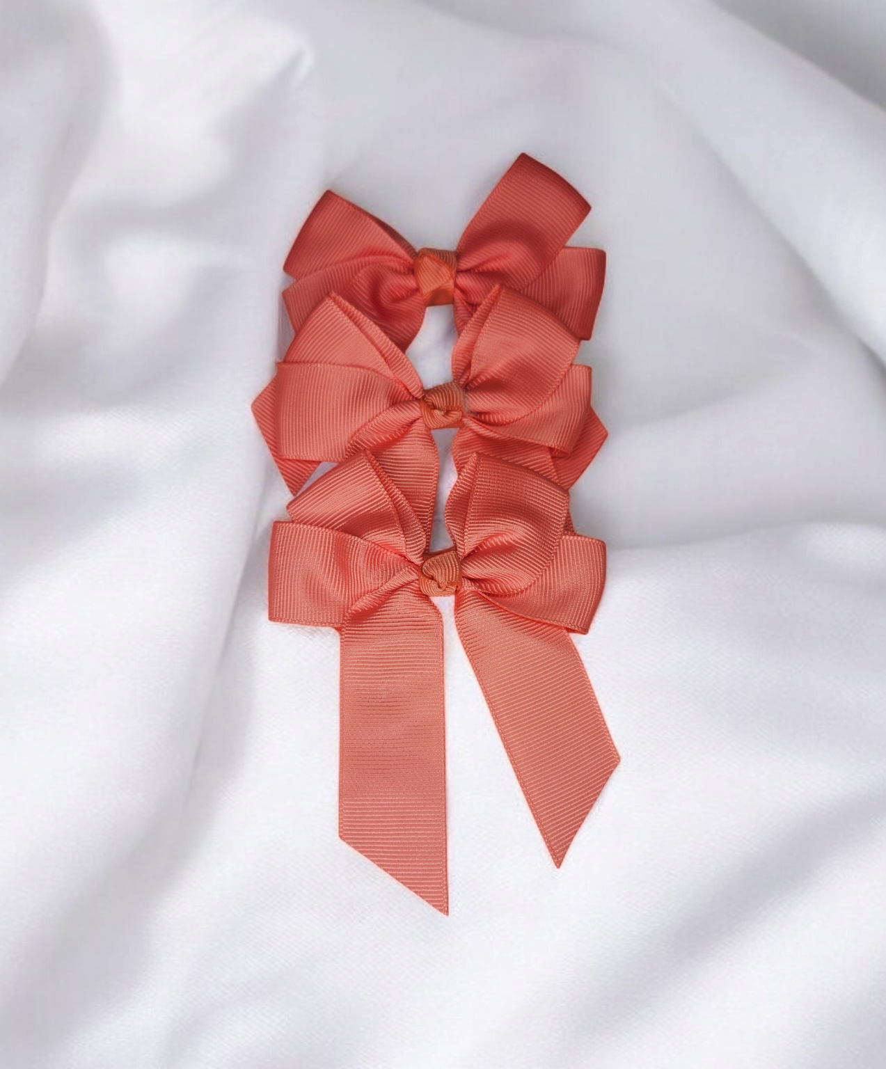 Salmon pink hair bow