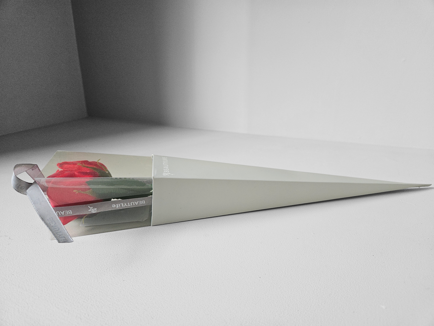 Single red rose in gift box